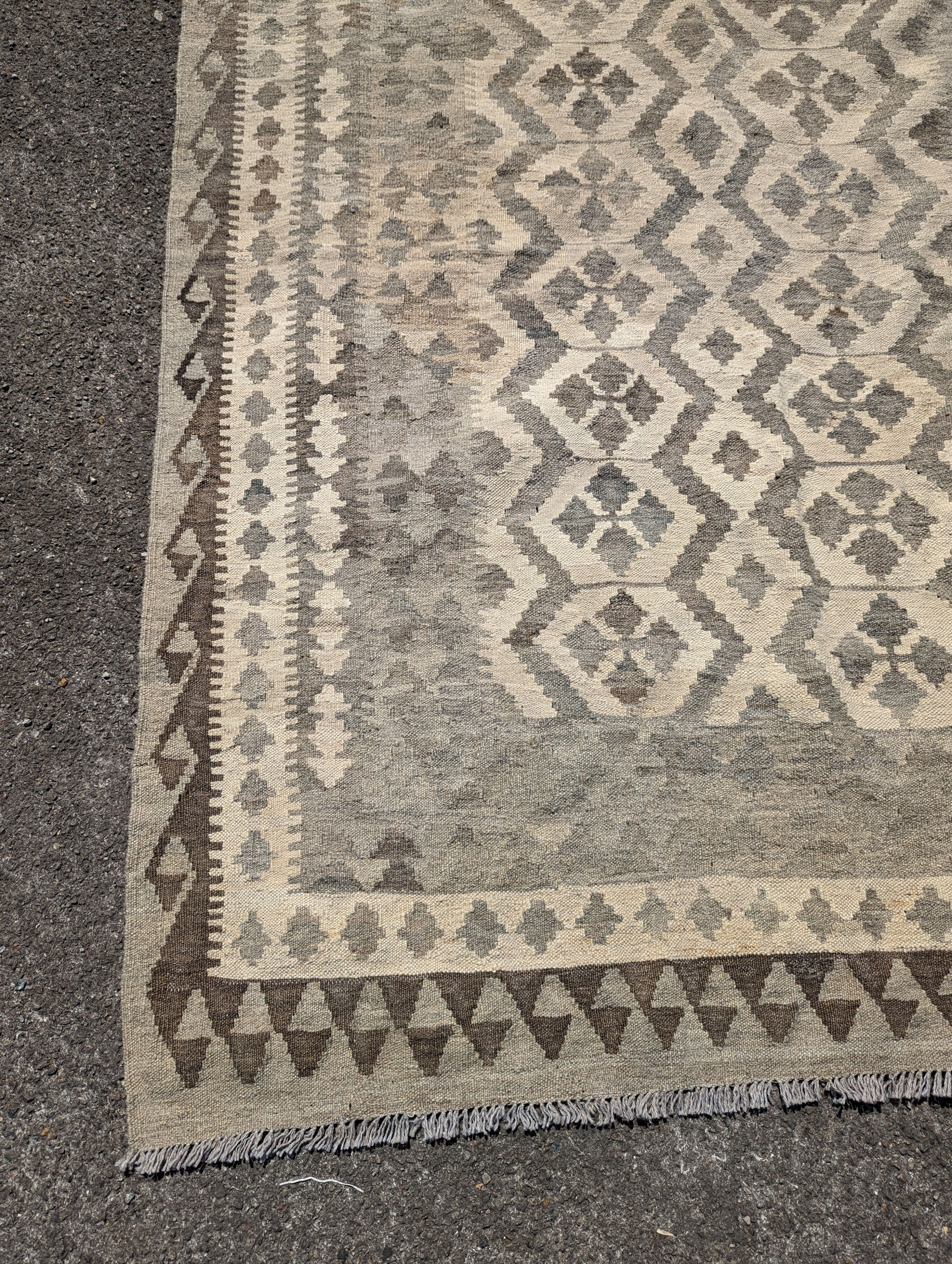 An Anatolian monochrome geometric flatweave carpet, 230 x 175cm